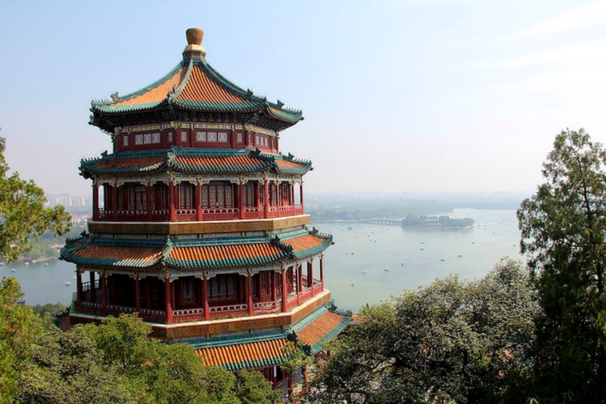 Traditional lakeside architecture surrounded by trees and water